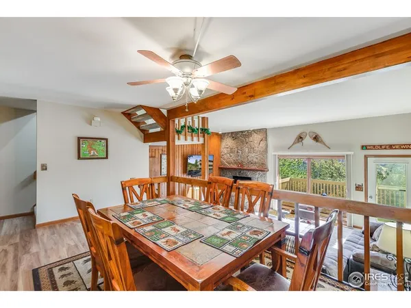 a living room with furniture a table and a large window