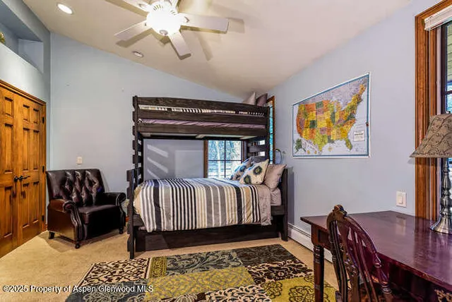 a bed room with furniture and a window