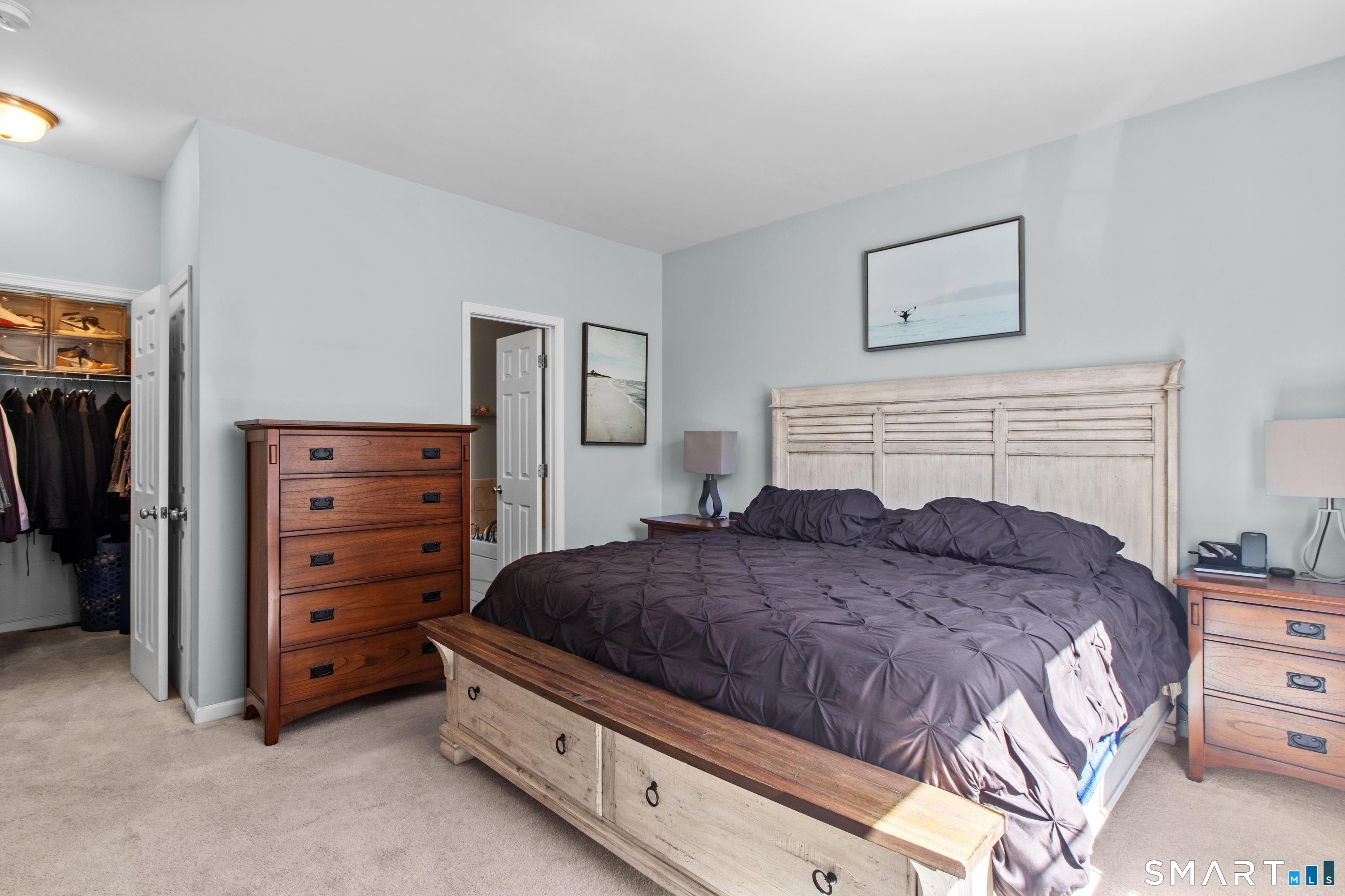 5 Haskins Road, Unit 5 Windsor, CT 06095 - Photo 28 of 40 a bedroom with a bed and a dresser