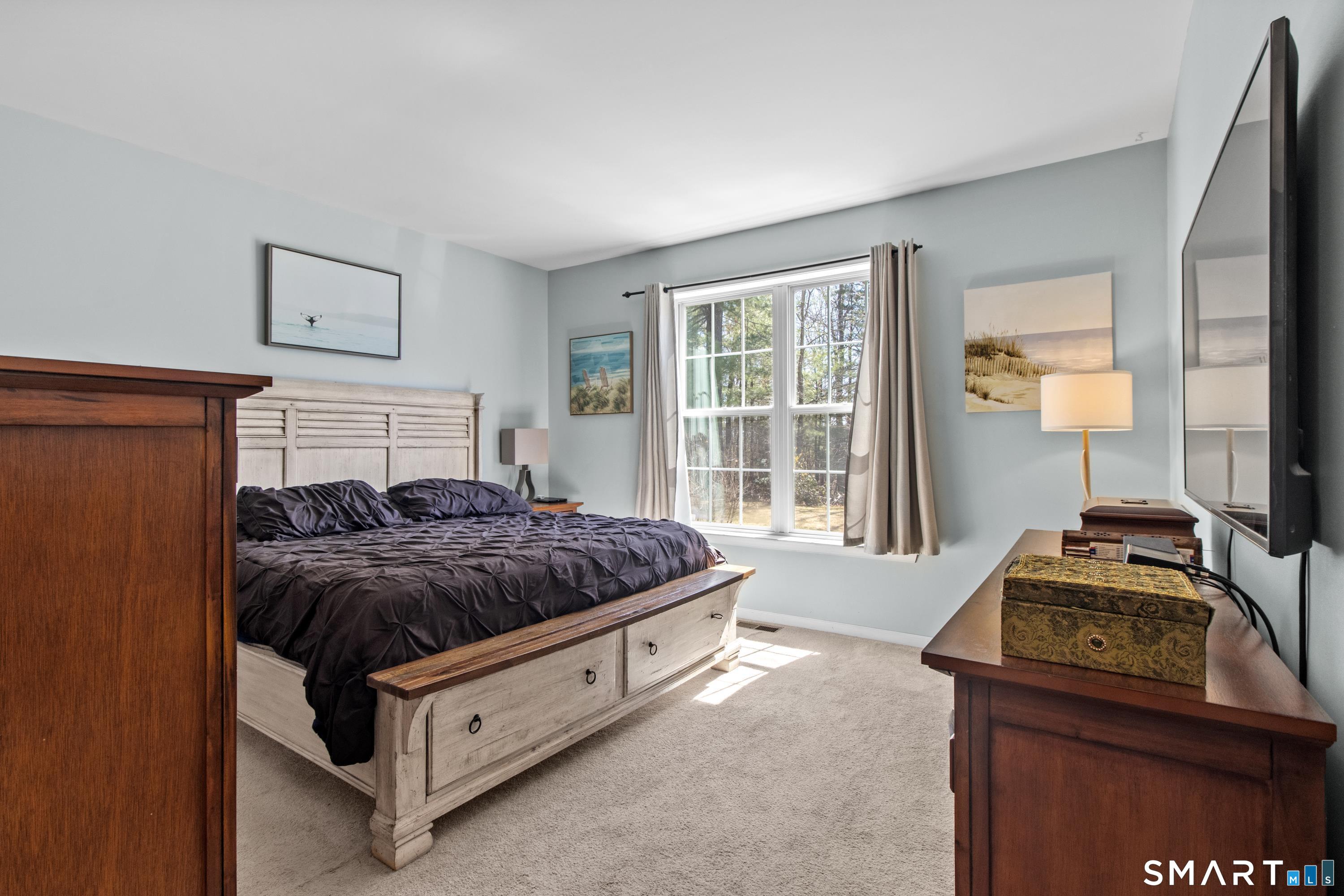 5 Haskins Road, Unit 5 Windsor, CT 06095 - Photo 29 of 40 a bedroom with a bed and a window