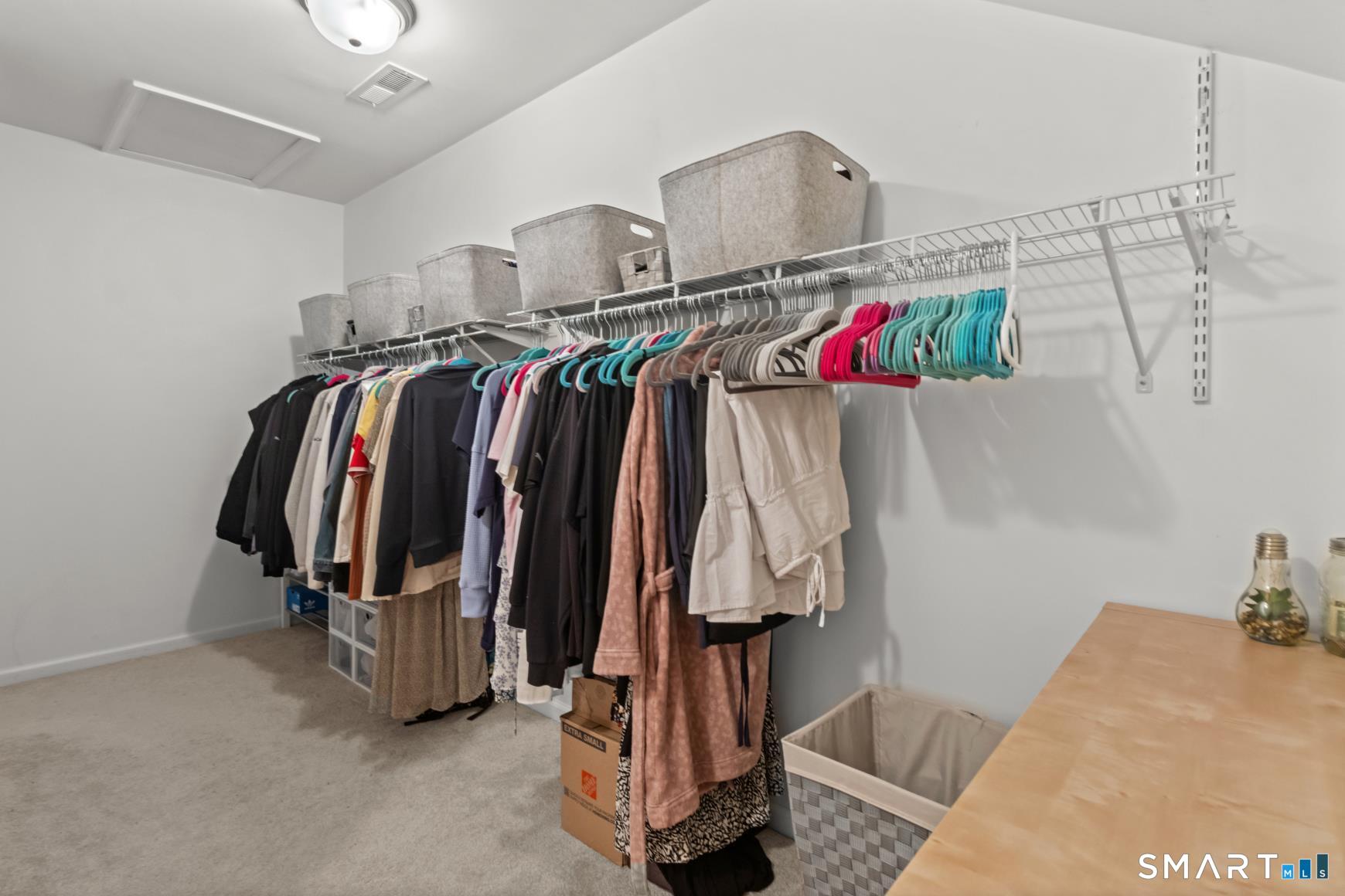 5 Haskins Road, Unit 5 Windsor, CT 06095 - Photo 30 of 40 a view of walk in closet with clothes and shoes