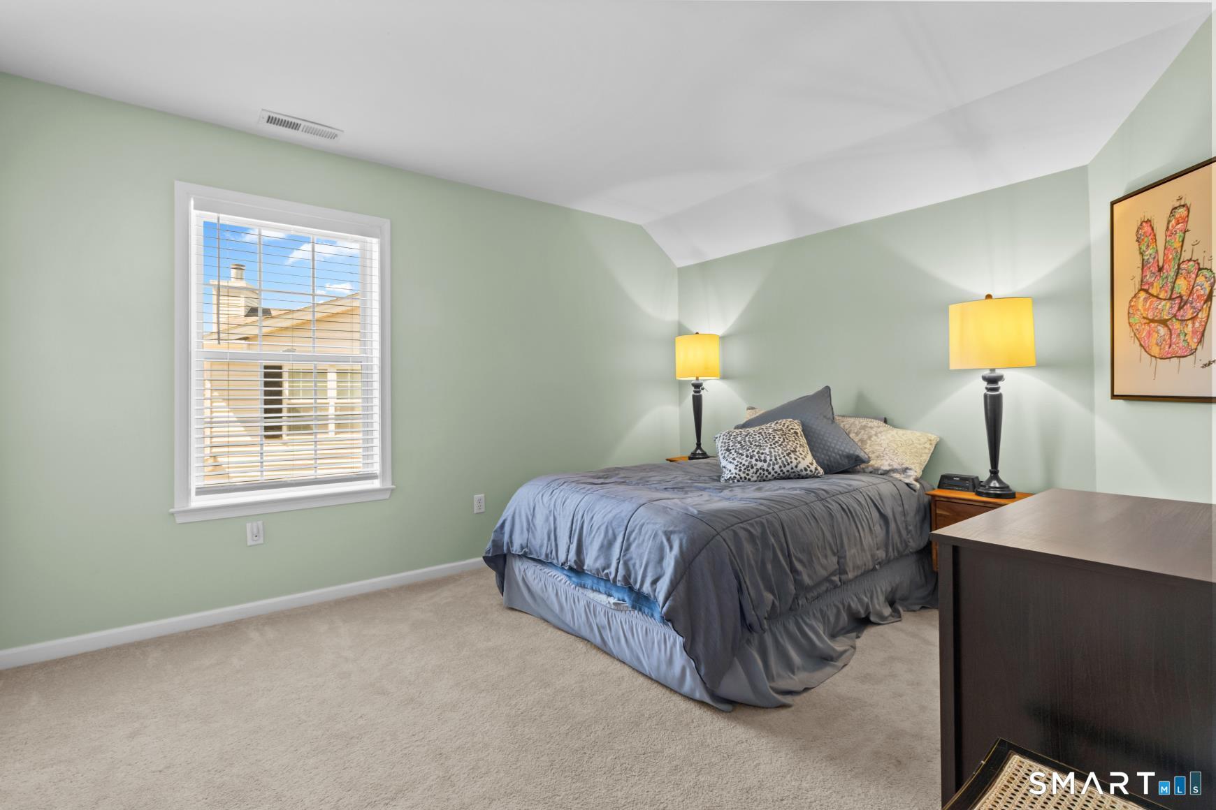5 Haskins Road, Unit 5 Windsor, CT 06095 - Photo 34 of 40 a spacious bedroom with a bed and lamps