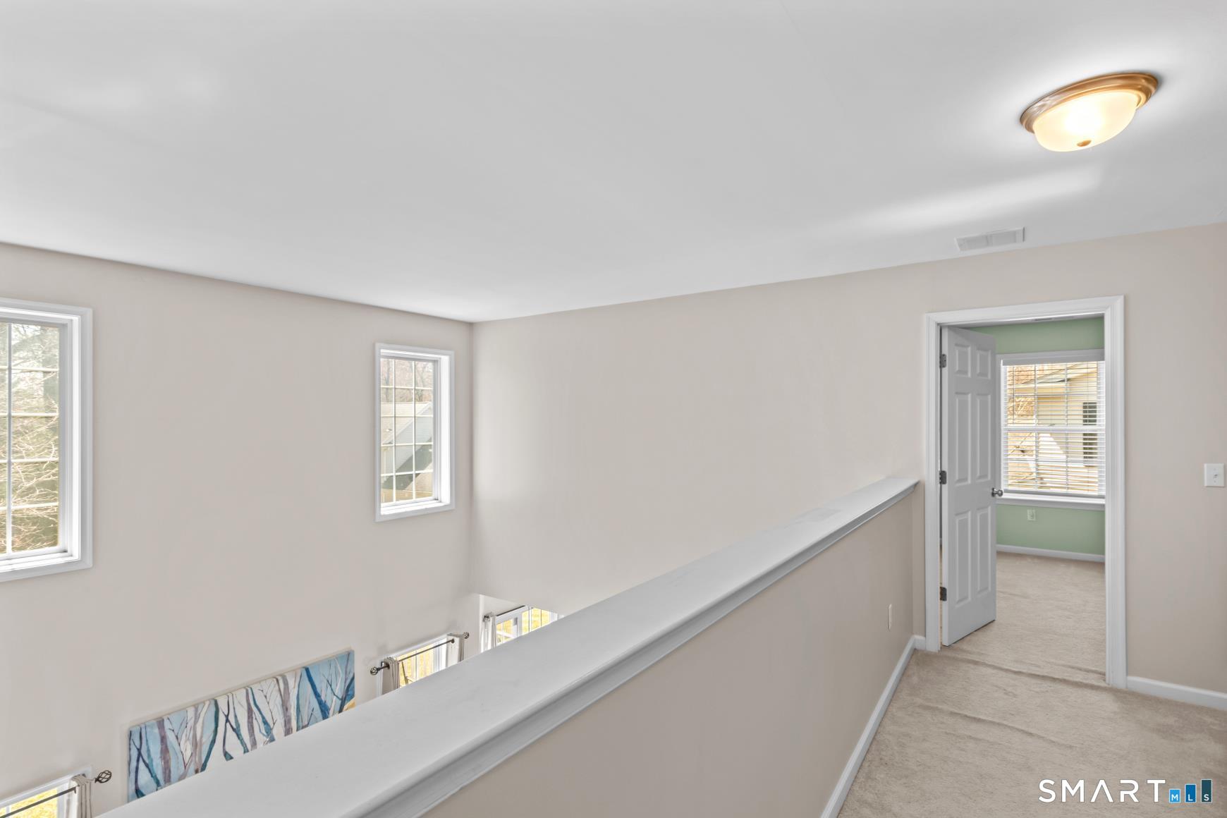 5 Haskins Road, Unit 5 Windsor, CT 06095 - Photo 36 of 40 a hallway with windows
