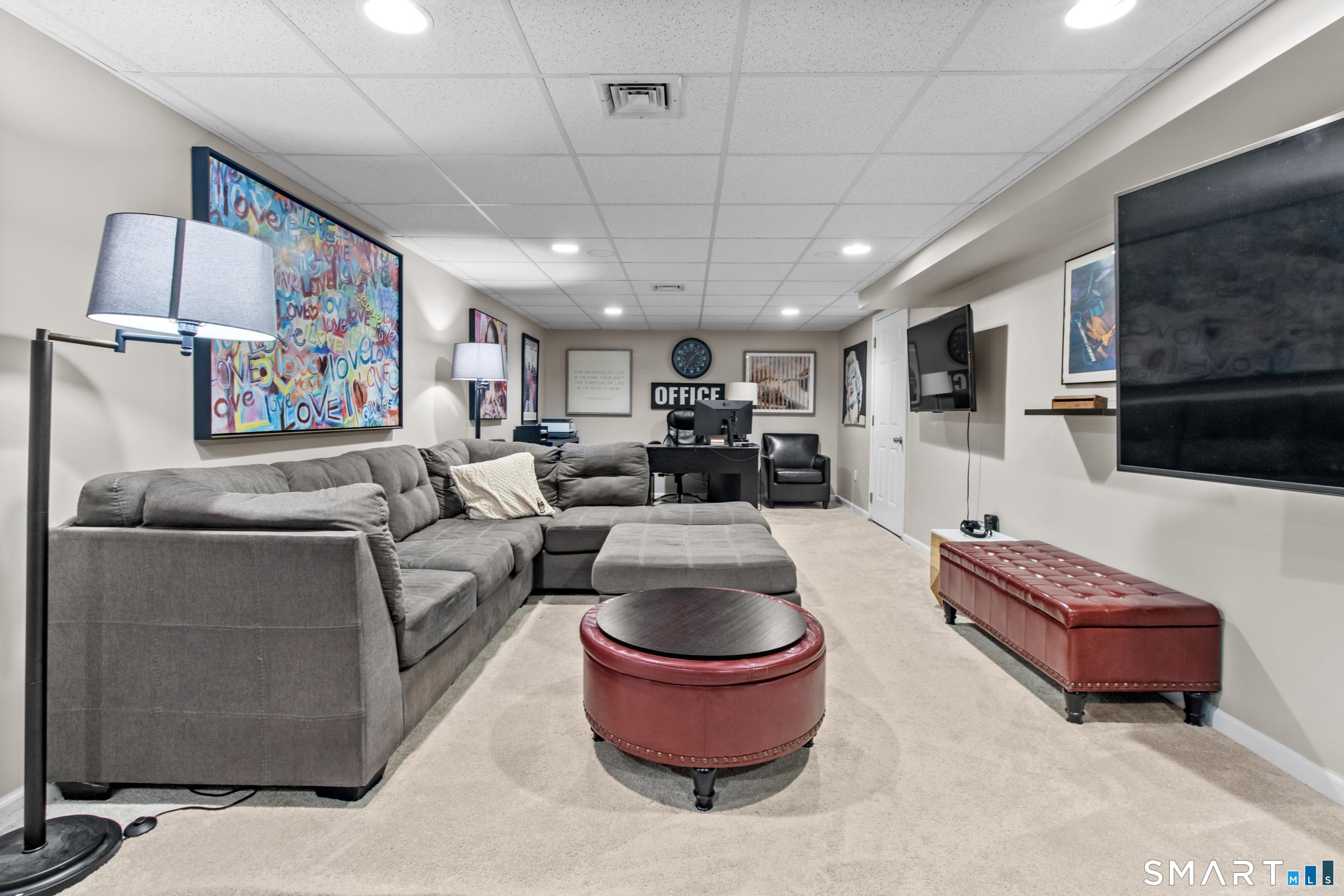 5 Haskins Road, Unit 5 Windsor, CT 06095 - Photo 40 of 40 a living room with furniture and a flat screen tv