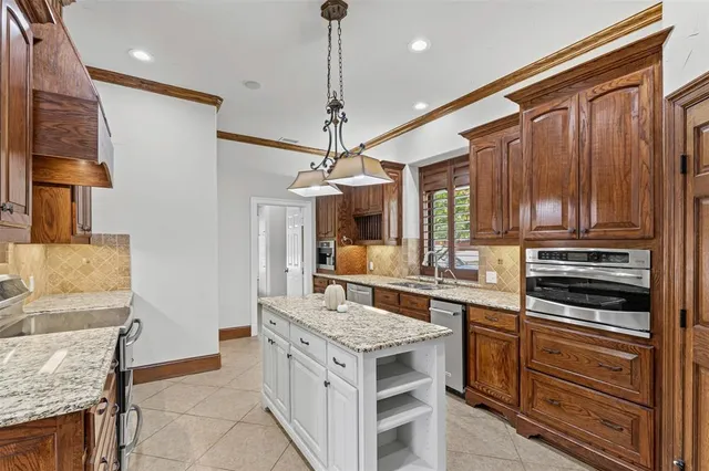 a kitchen with a stove and a refrigerator
