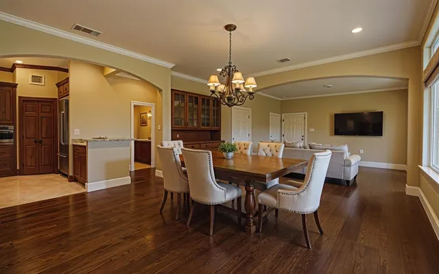 a view of a dining room with furniture and wooden floor