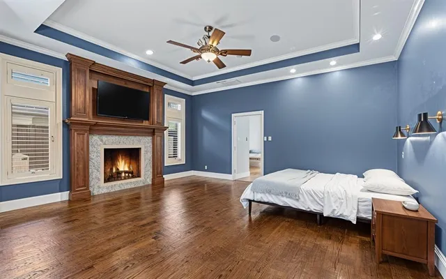 a bedroom with a bed and a fireplace