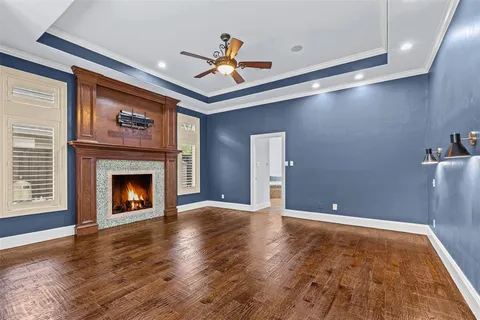 a view of an empty room with window and fire place