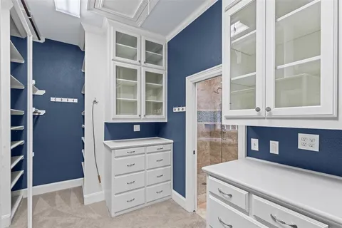 a view of cabinets and window