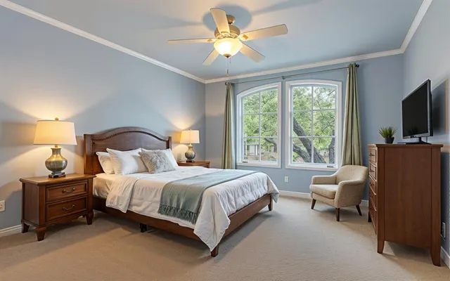 a bedroom with a bed and a chandelier