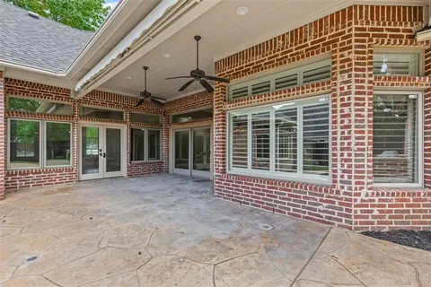 a view of house with backyard