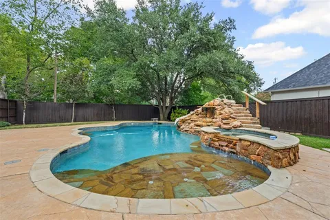 a view of a swimming pool with a patio