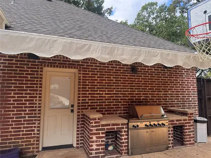 a view of a brick wall and front door