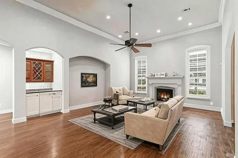 a living room with furniture and a fireplace