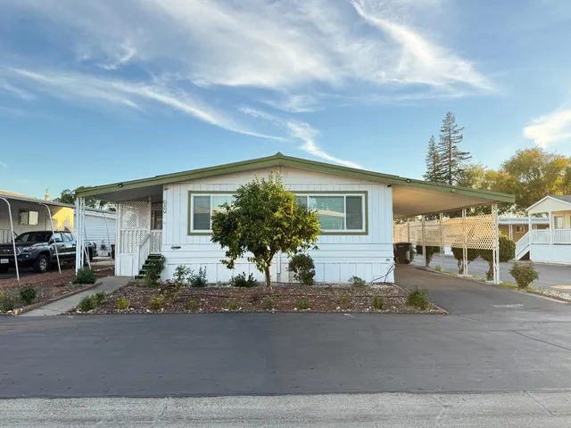 a view of a house with a street