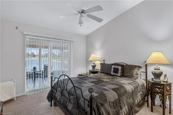 a bedroom with a bed and a table