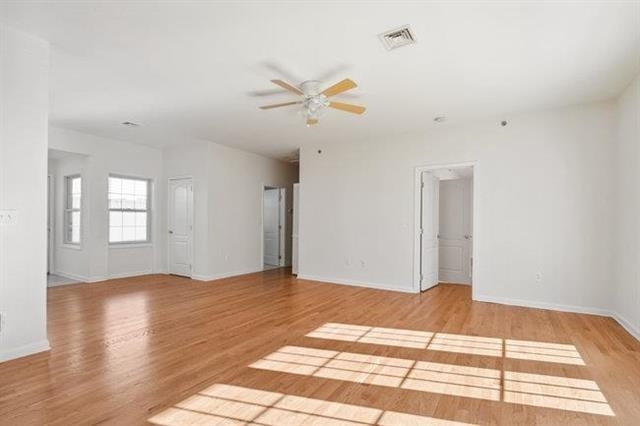683 Main Street, Unit 22 Hackensack, NJ 07601 - Photo 2 of 15 a view of a room with a ceiling fan and wooden floor