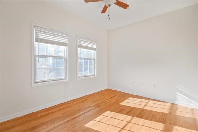 683 Main Street, Unit 22 Hackensack, NJ 07601 - Photo 4 of 15 a view of an empty room with wooden floor and a window