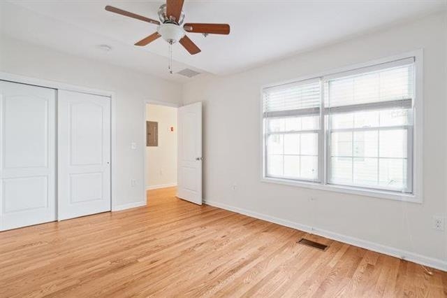 683 Main Street, Unit 22 Hackensack, NJ 07601 - Photo 9 of 15 wooden floor in an empty room with a window