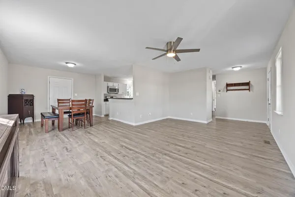 a view of a livingroom with furniture and a ceiling fan