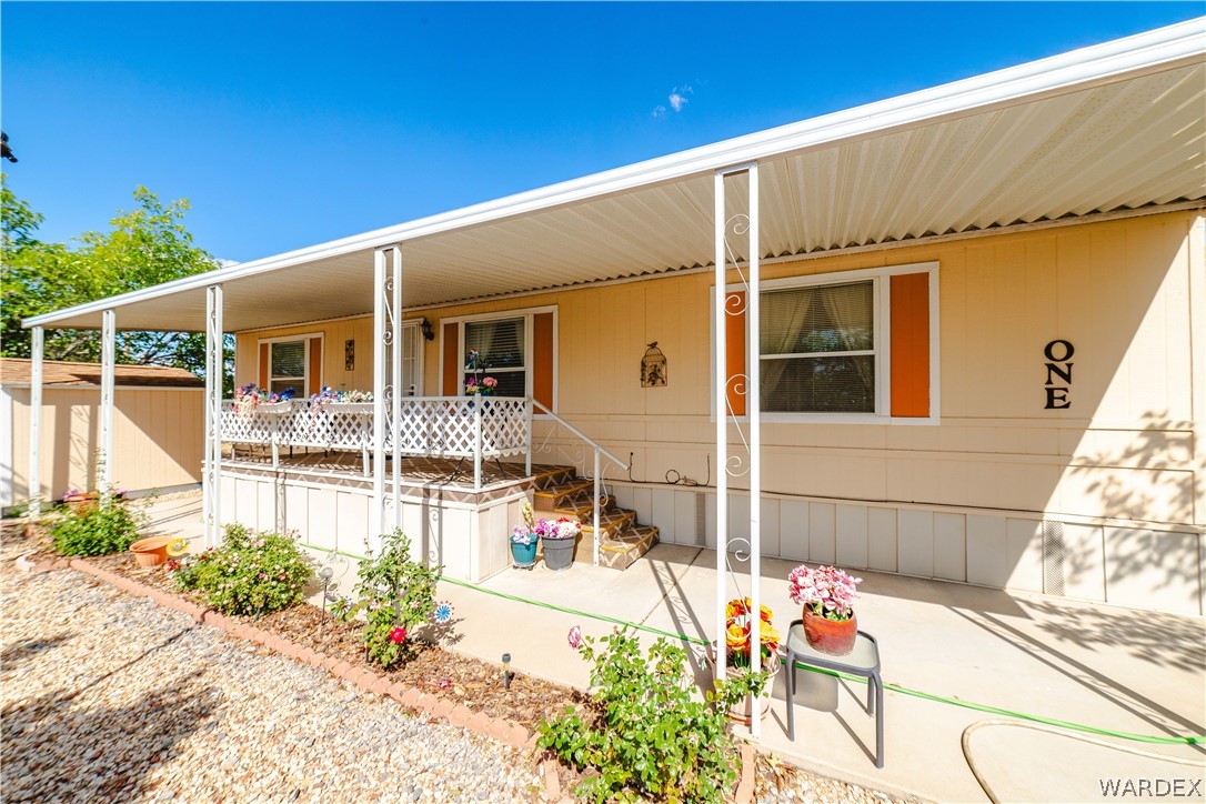 3003 Hualapai Mountain Road Kingman, AZ 86401 - Photo 2 of 49 a front view of a house with a patio