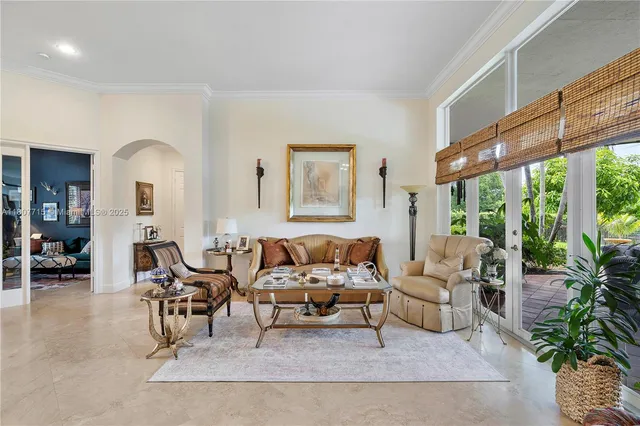 a kitchen with kitchen island granite countertop a sink counter top space appliances and cabinets
