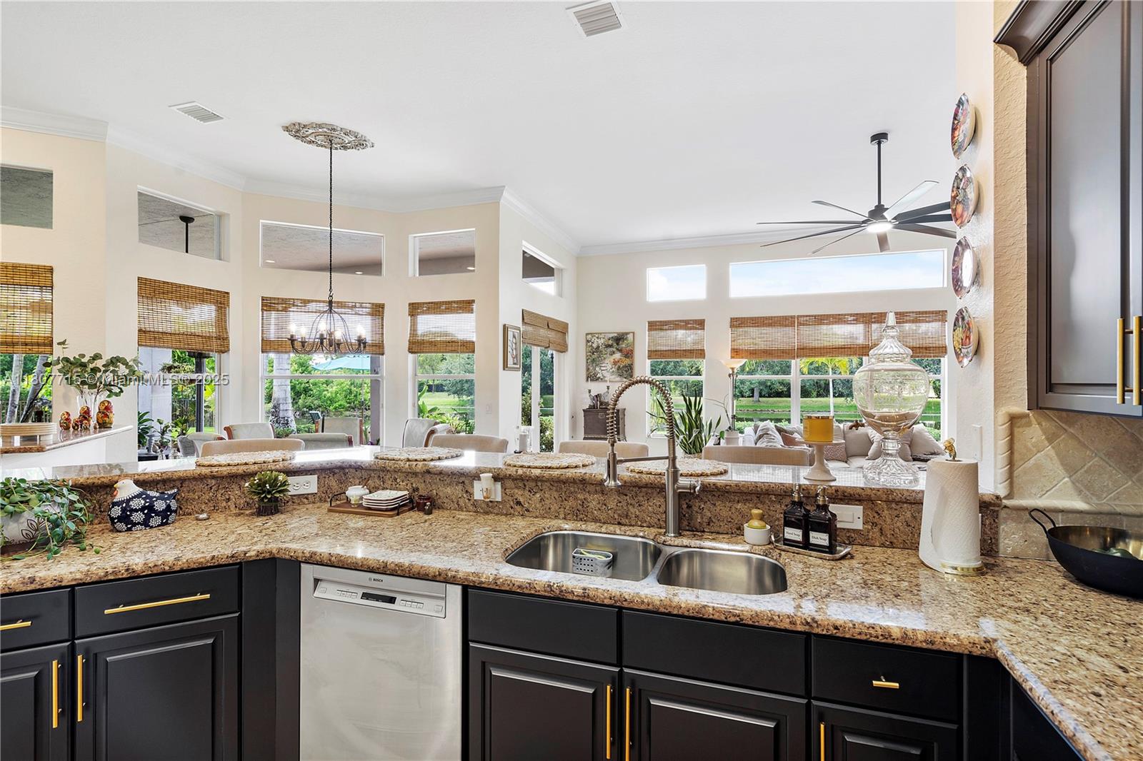14933 Southwest 33rd Street Davie, FL 33331 - Photo 25 of 88 a kitchen with stainless steel appliances granite countertop a sink and a counter space
