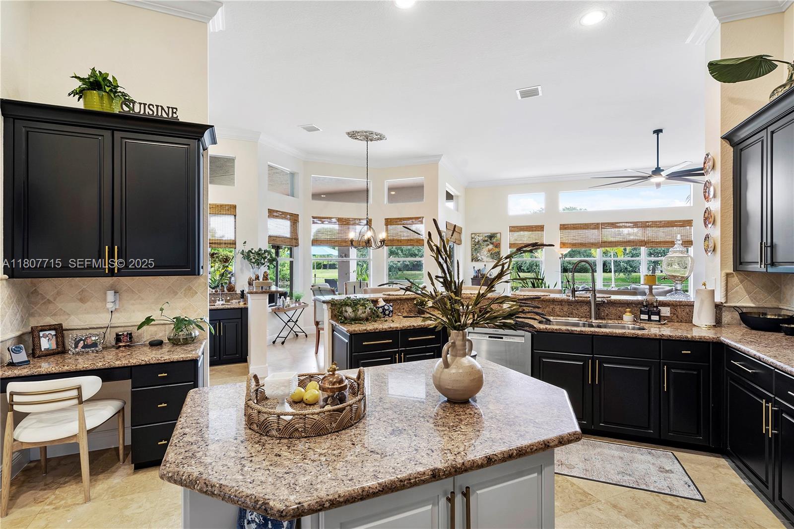 14933 Southwest 33rd Street Davie, FL 33331 - Photo 26 of 88 a kitchen with granite countertop a sink and a stove top oven