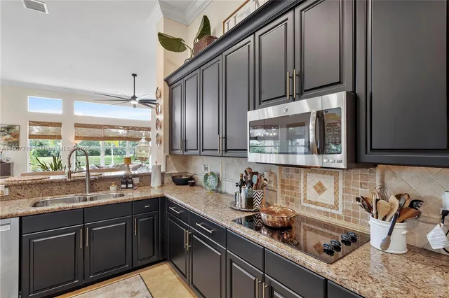 a spacious bathroom with a double vanity sink large mirror and a bathtub