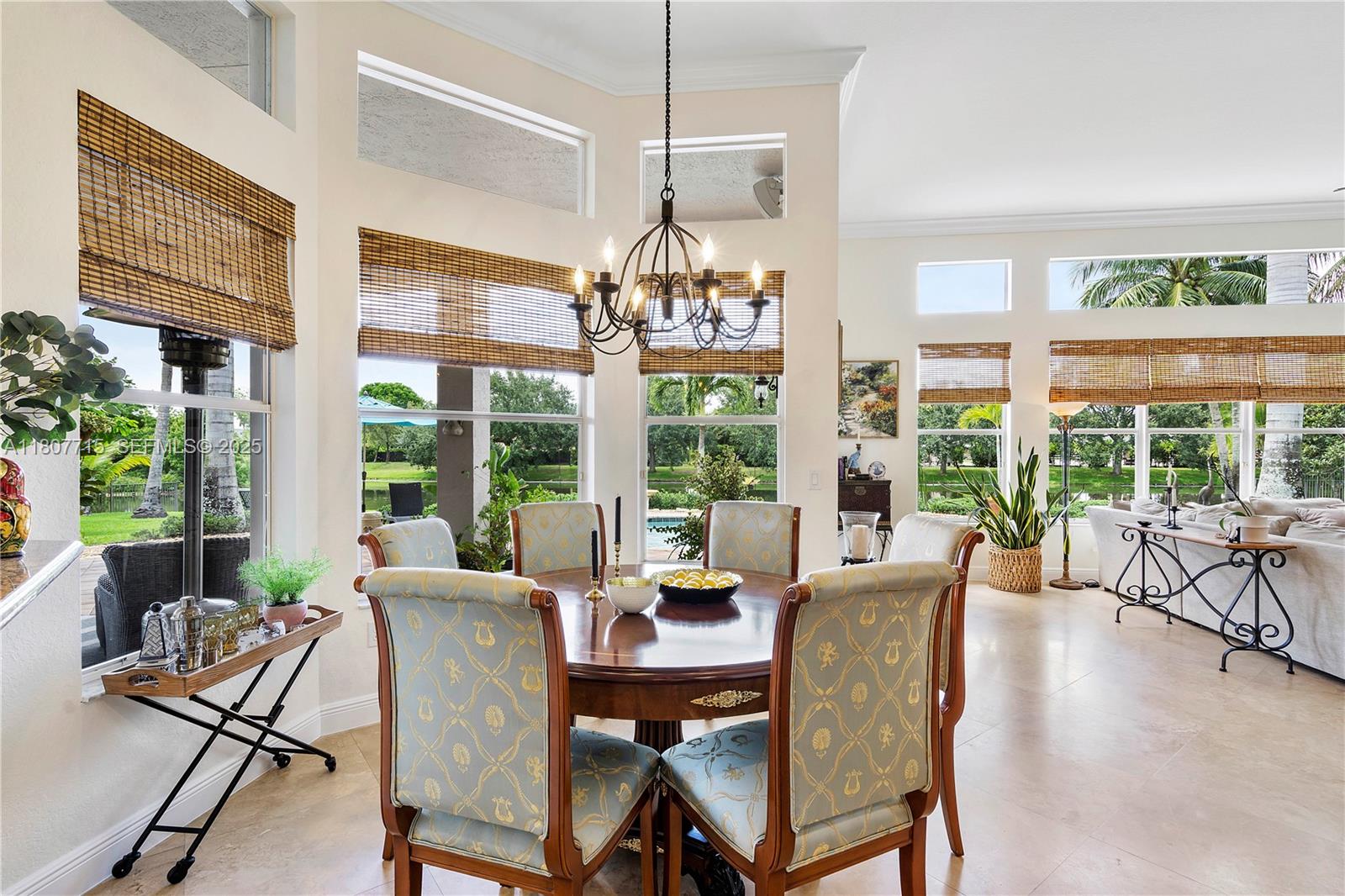 14933 Southwest 33rd Street Davie, FL 33331 - Photo 28 of 88 a view of a dining room with furniture large windows and wooden floor