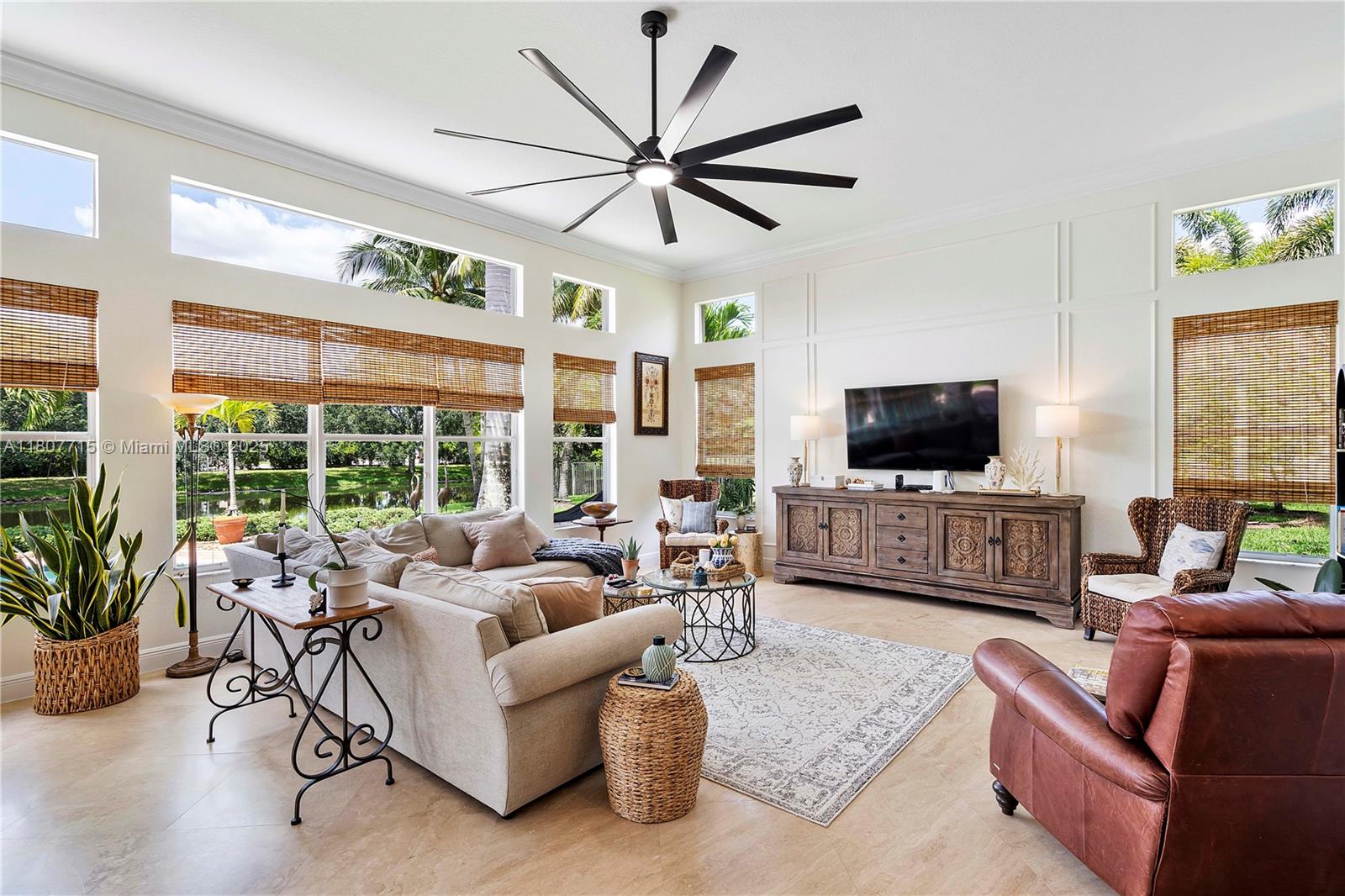 14933 Southwest 33rd Street Davie, FL 33331 - Photo 30 of 88 a living room with furniture and a flat screen tv