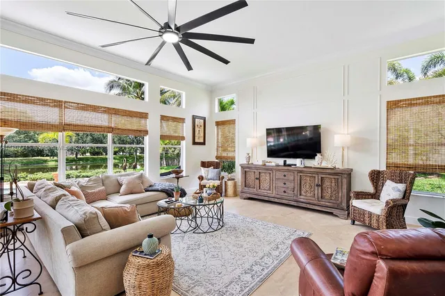 a view of a patio with couches and potted plants
