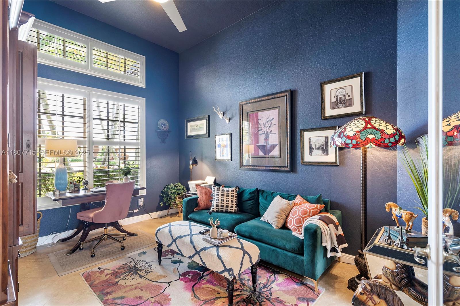 14933 Southwest 33rd Street Davie, FL 33331 - Photo 34 of 88 a living room with furniture and a floor to ceiling window