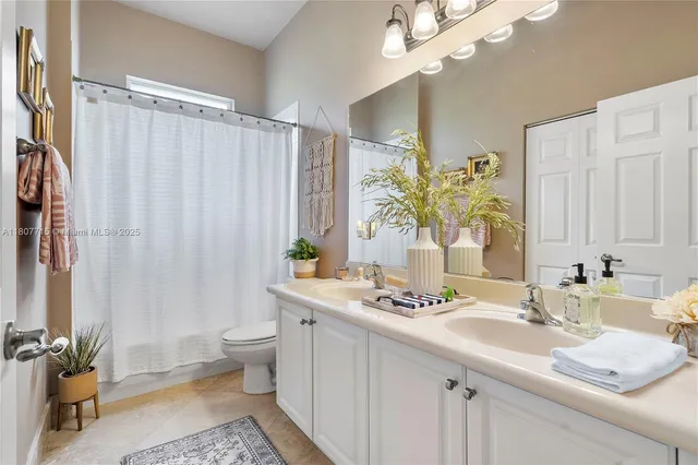 an aerial view of residential houses with outdoor space and street view