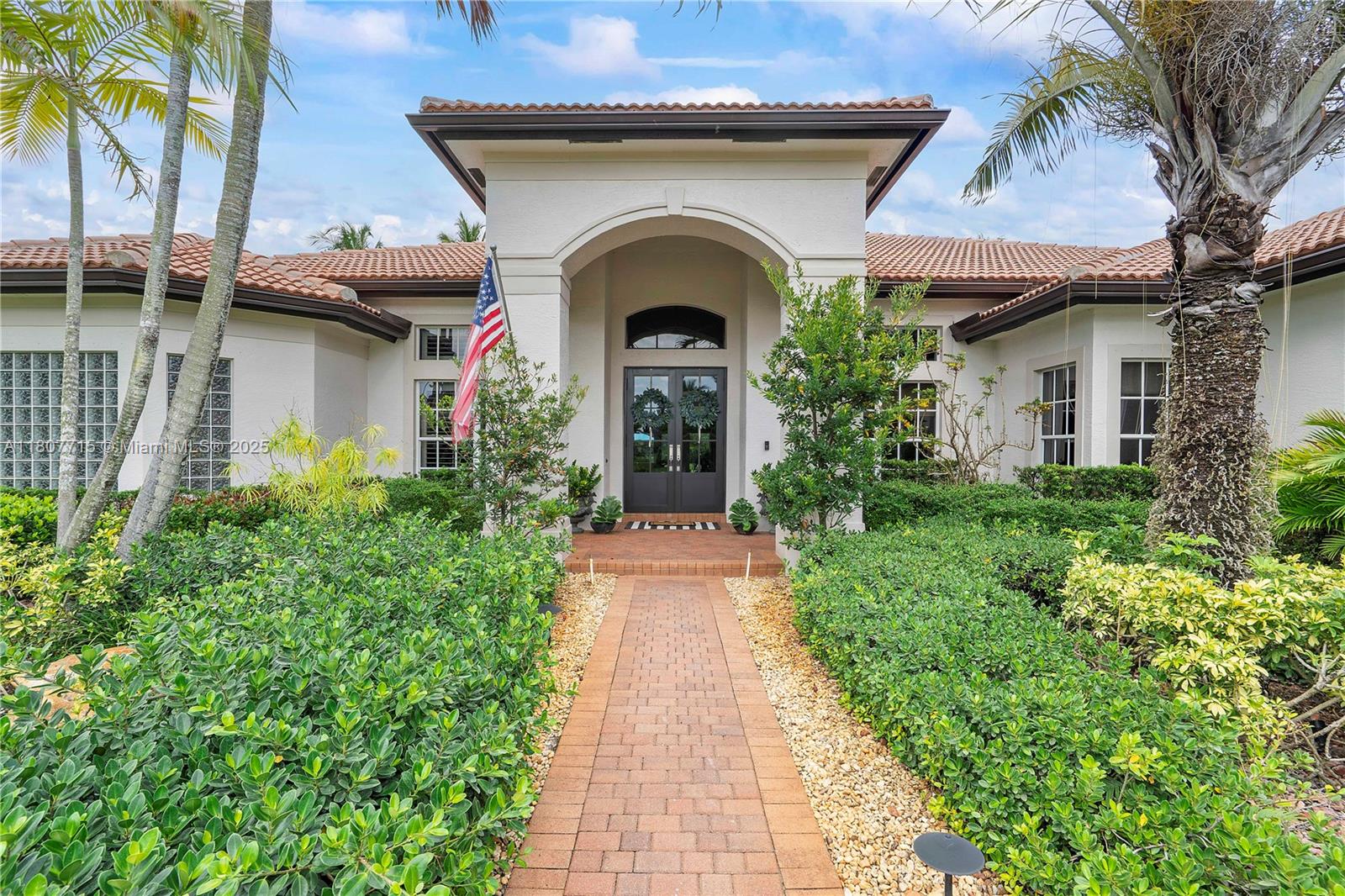 14933 Southwest 33rd Street Davie, FL 33331 - Photo 5 of 88 a front view of a house with garden