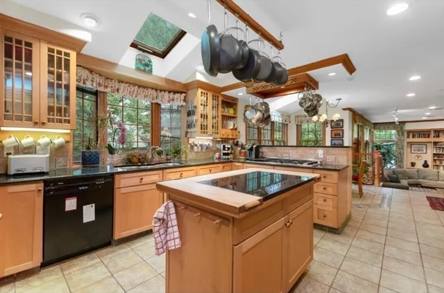 a kitchen that has a sink and a stove