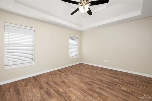 a bathroom with a sink a toilet a mirror and shower