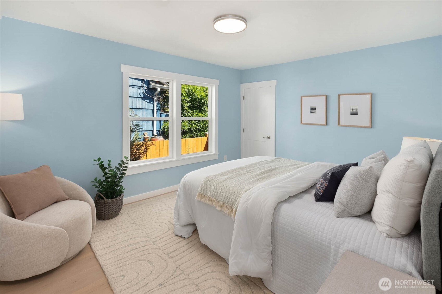1312 Northeast 70th Street Seattle, WA 98115 - Photo 13 of 36 a bedroom with a bed and couch