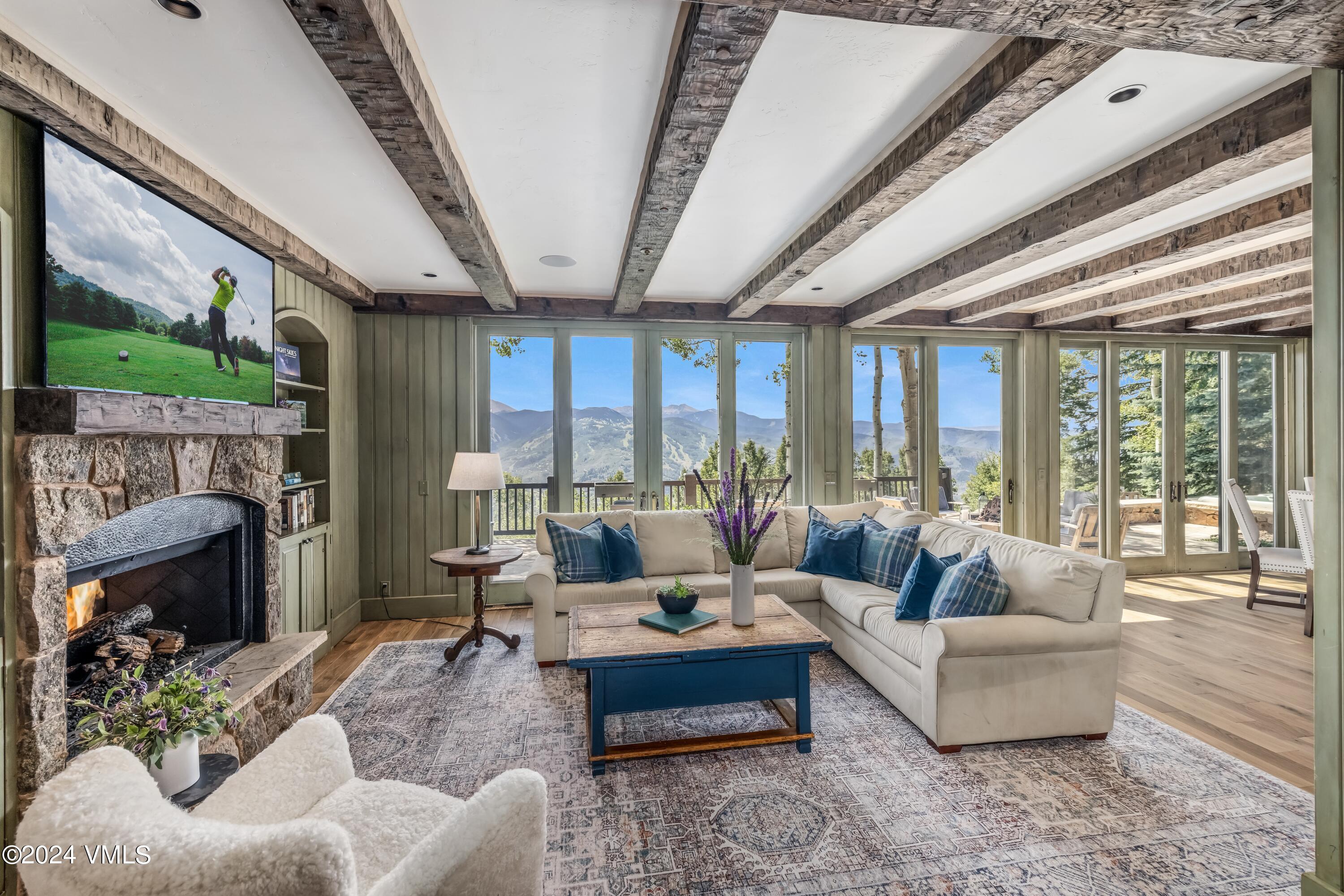 48 Jasmine Avon, CO 81620 - Photo 16 of 67 a living room with furniture and a fireplace