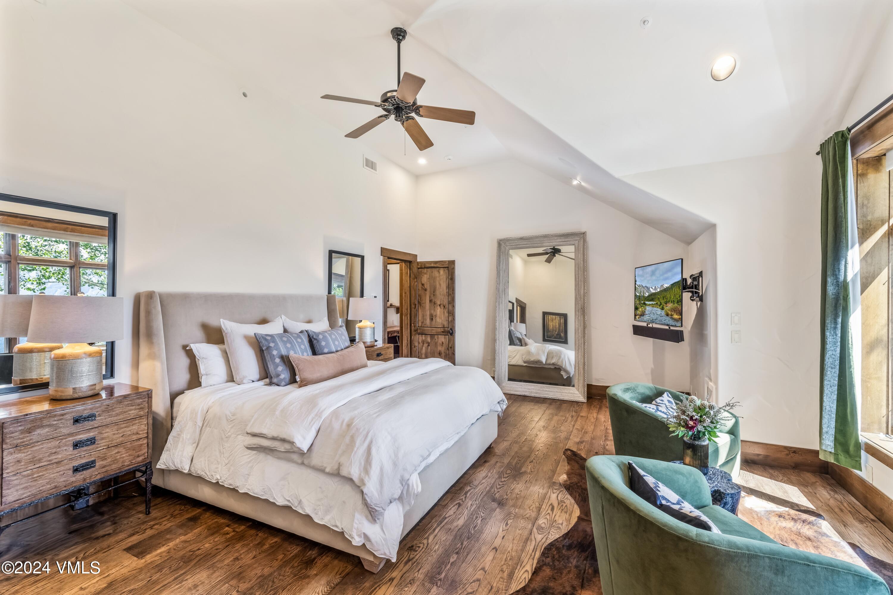 48 Jasmine Avon, CO 81620 - Photo 17 of 67 a spacious bedroom with a bed and wooden floor