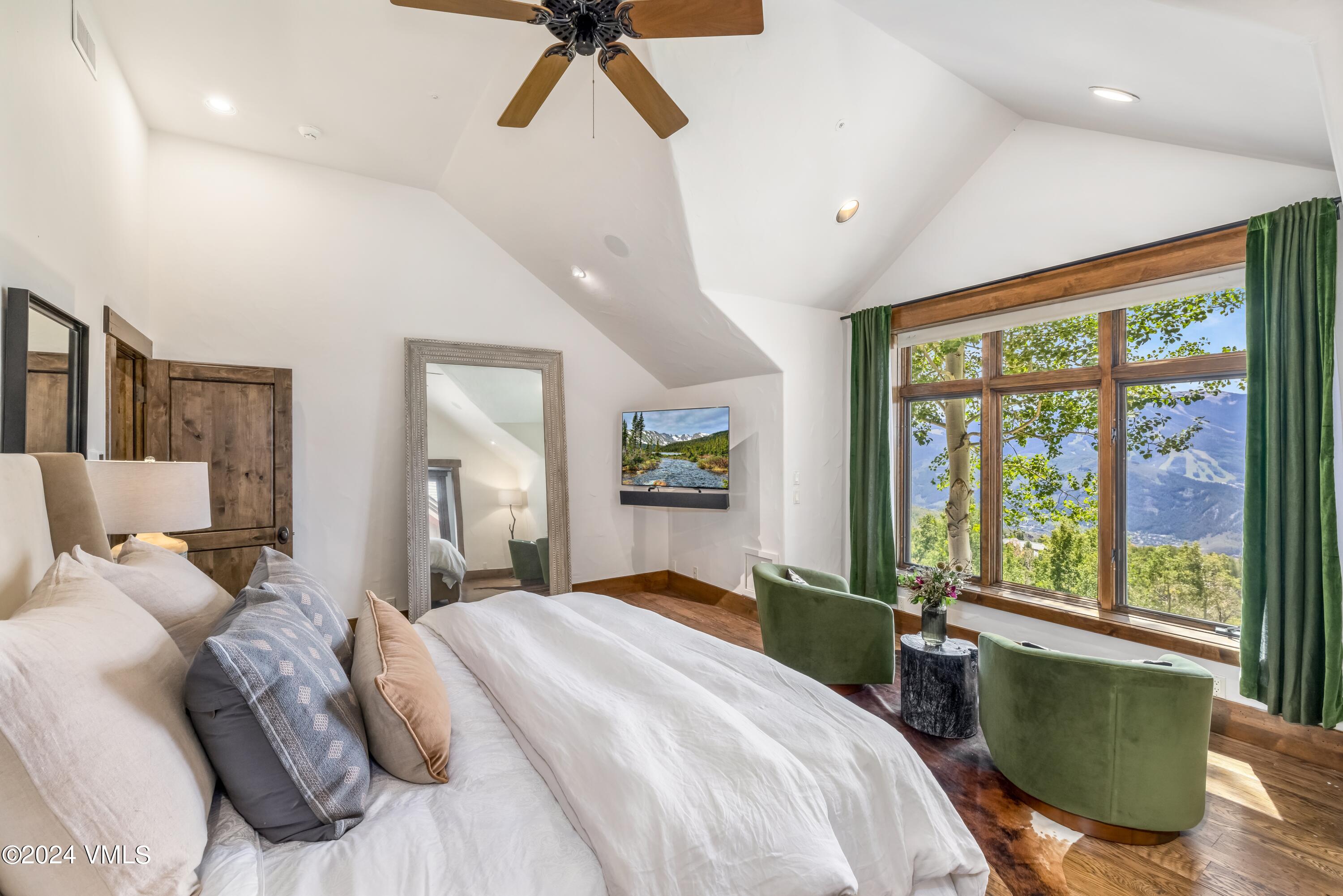 48 Jasmine Avon, CO 81620 - Photo 19 of 67 a bedroom with a large bed and a large window