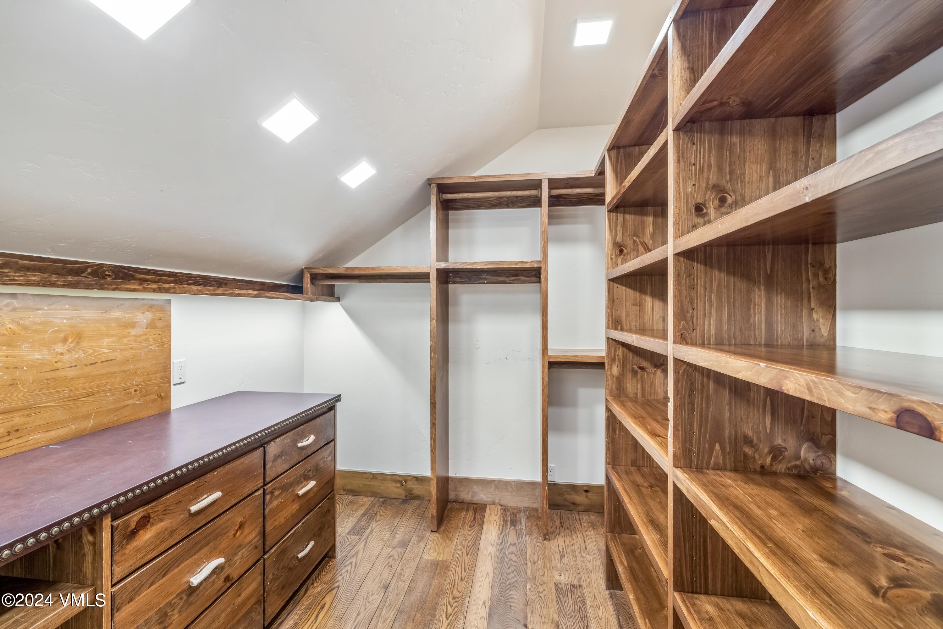 48 Jasmine Avon, CO 81620 - Photo 23 of 67 a view of walk in closet with wooden floor
