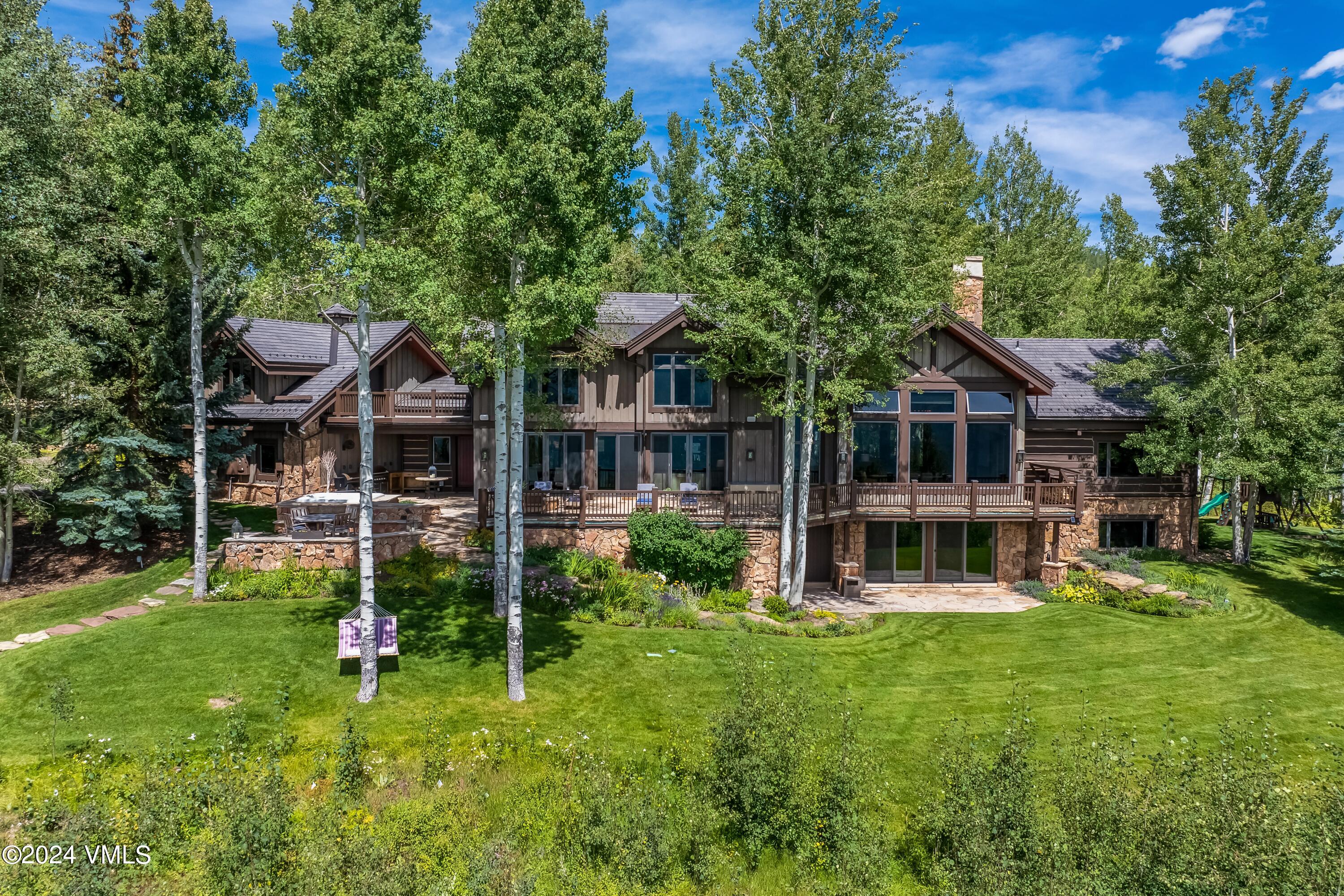 48 Jasmine Avon, CO 81620 - Photo 29 of 67 a view of a house with a yard and sitting area
