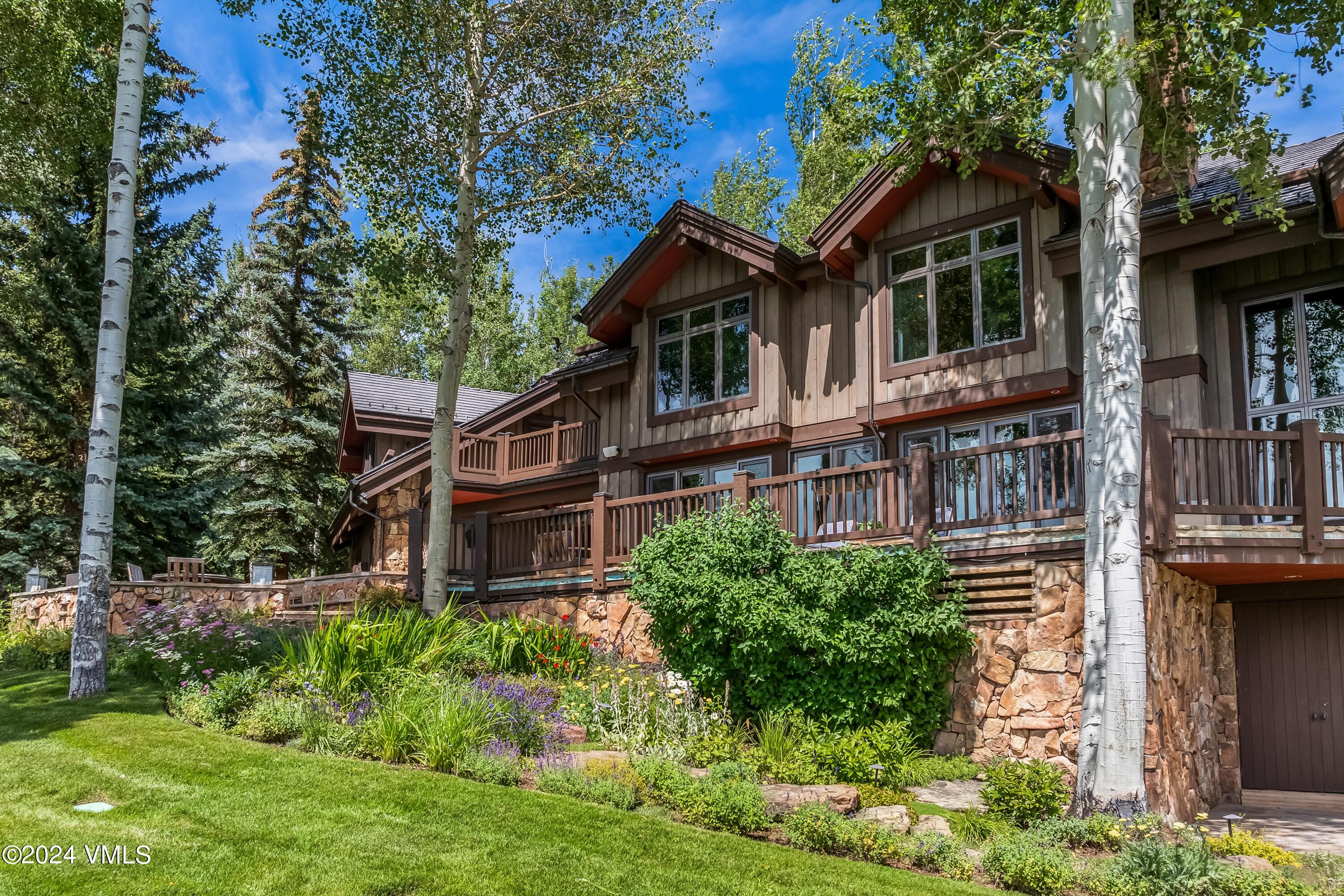 48 Jasmine Avon, CO 81620 - Photo 31 of 67 a front view of a house with garden