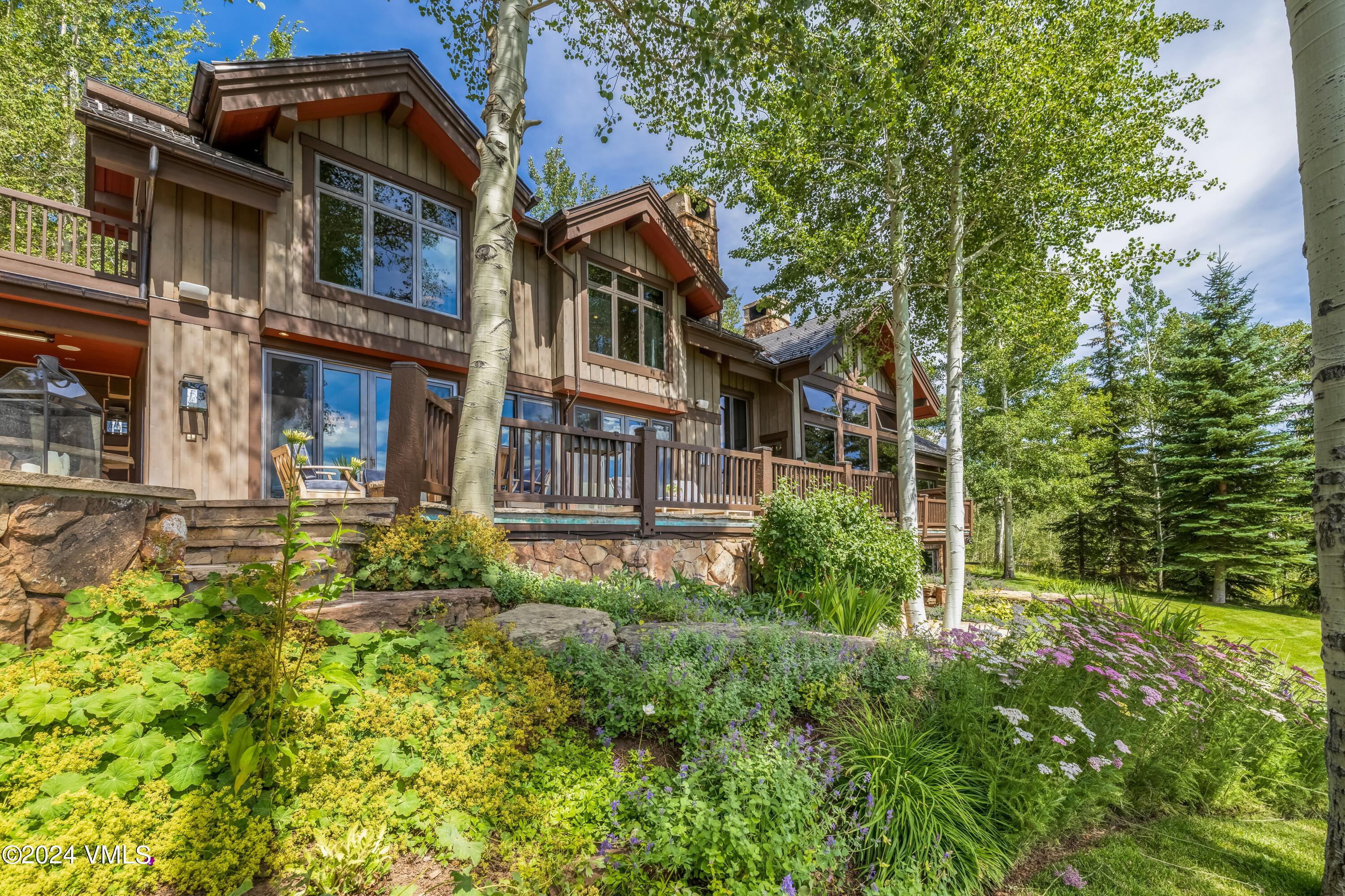 48 Jasmine Avon, CO 81620 - Photo 34 of 67 a view of a house with brick walls and flower plants