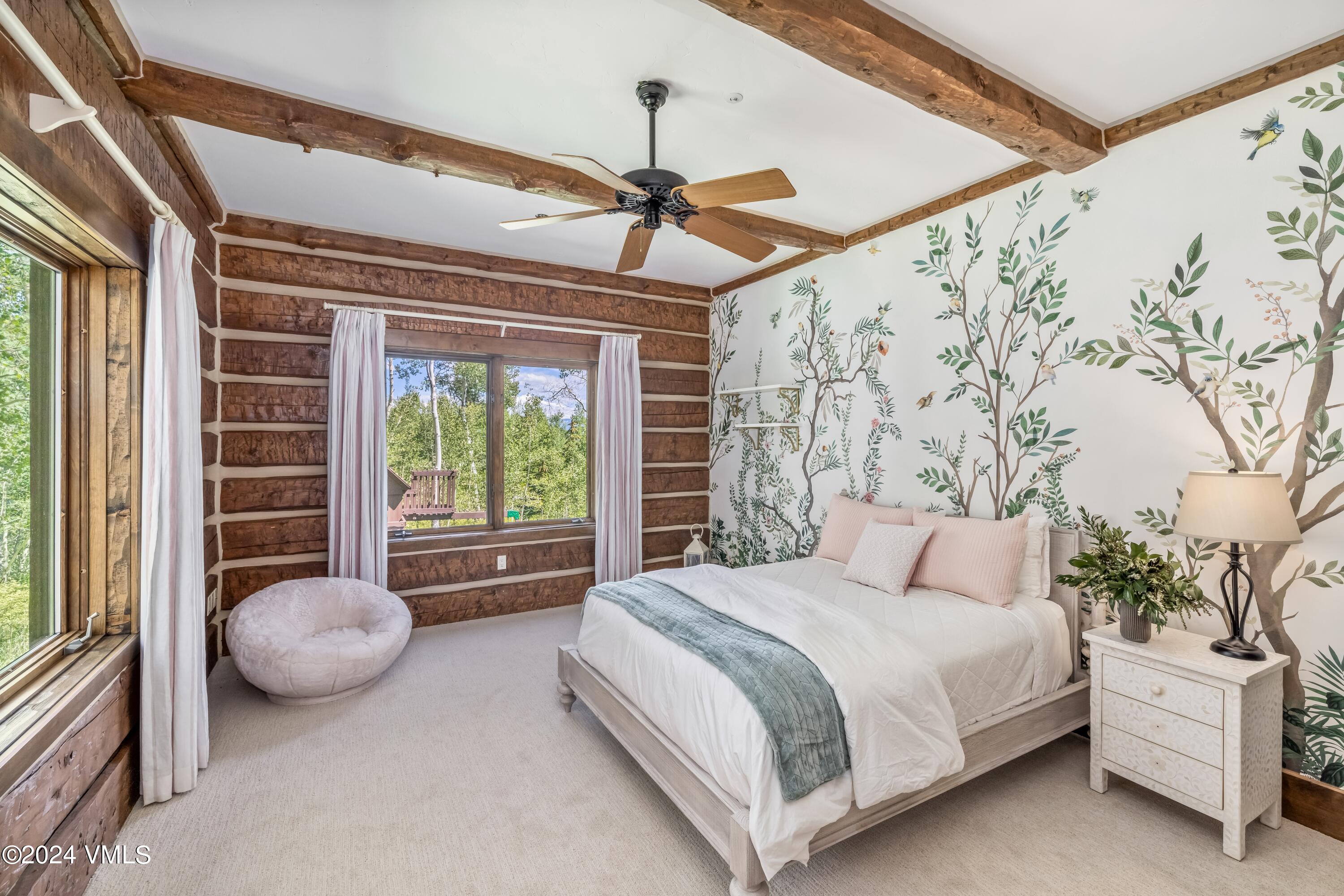 48 Jasmine Avon, CO 81620 - Photo 49 of 67 a bedroom with a bed and a large window