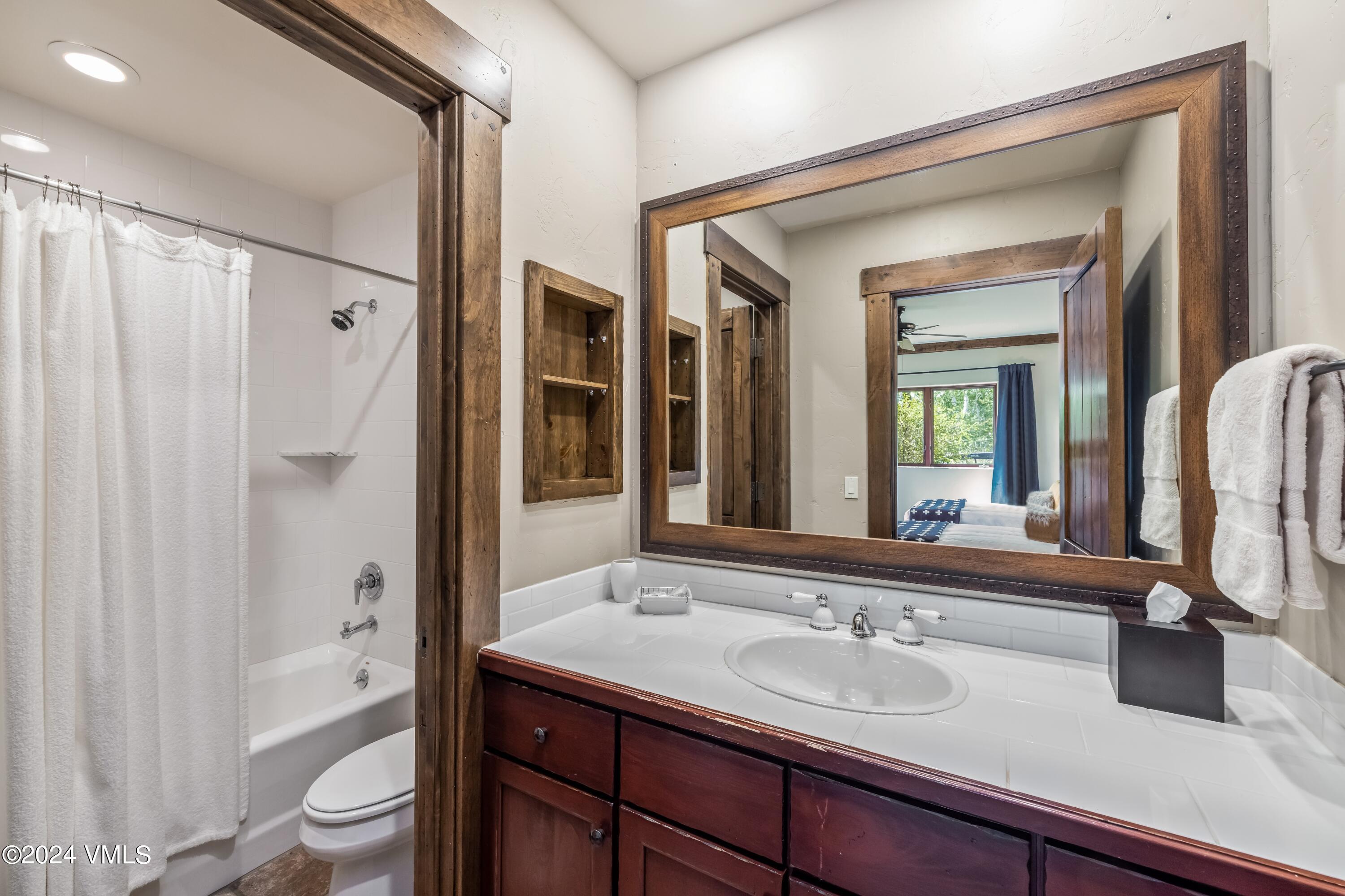 48 Jasmine Avon, CO 81620 - Photo 54 of 67 a bathroom with a sink a toilet and shower