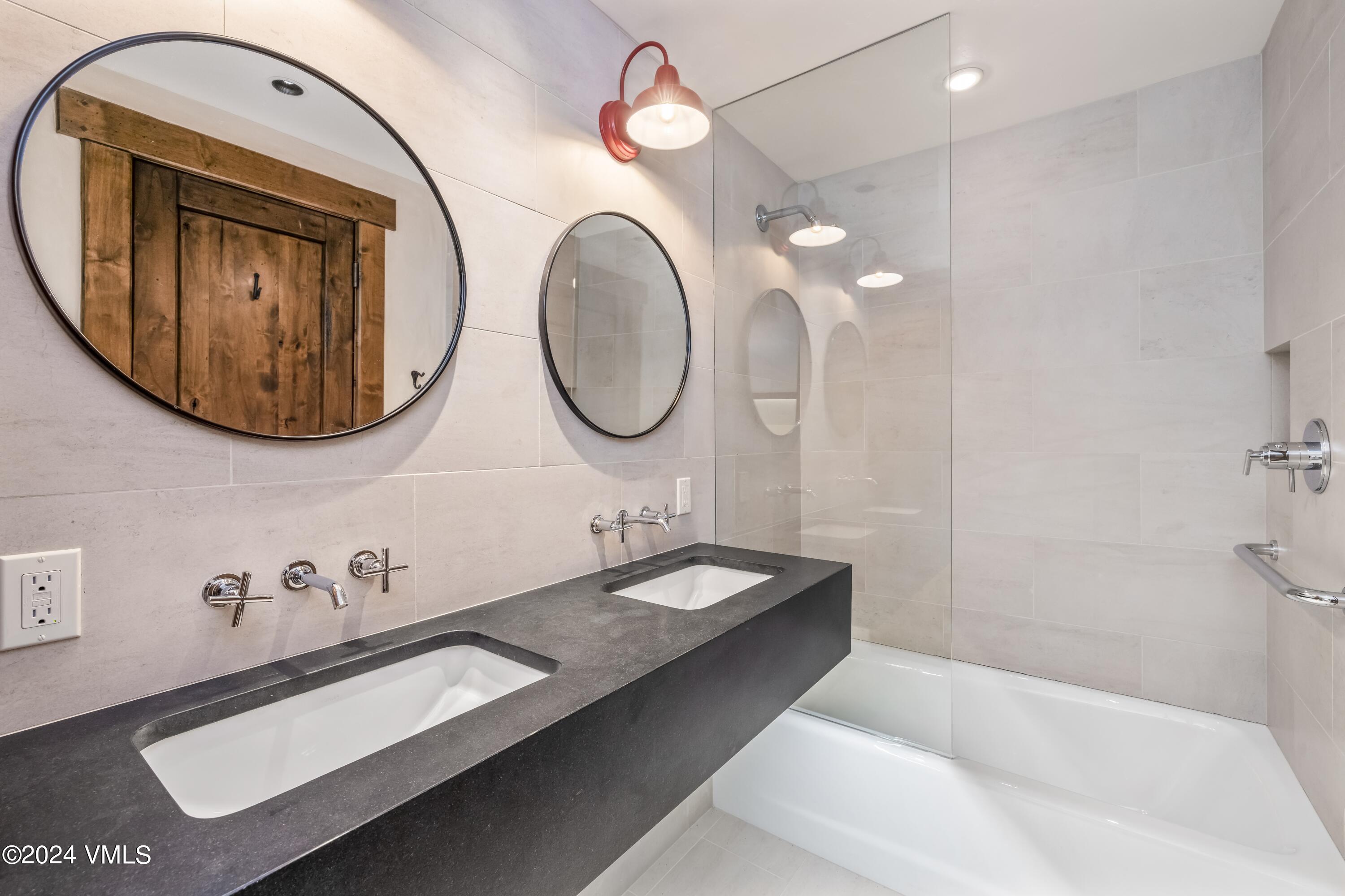 48 Jasmine Avon, CO 81620 - Photo 59 of 67 a bathroom with a sink and a mirror