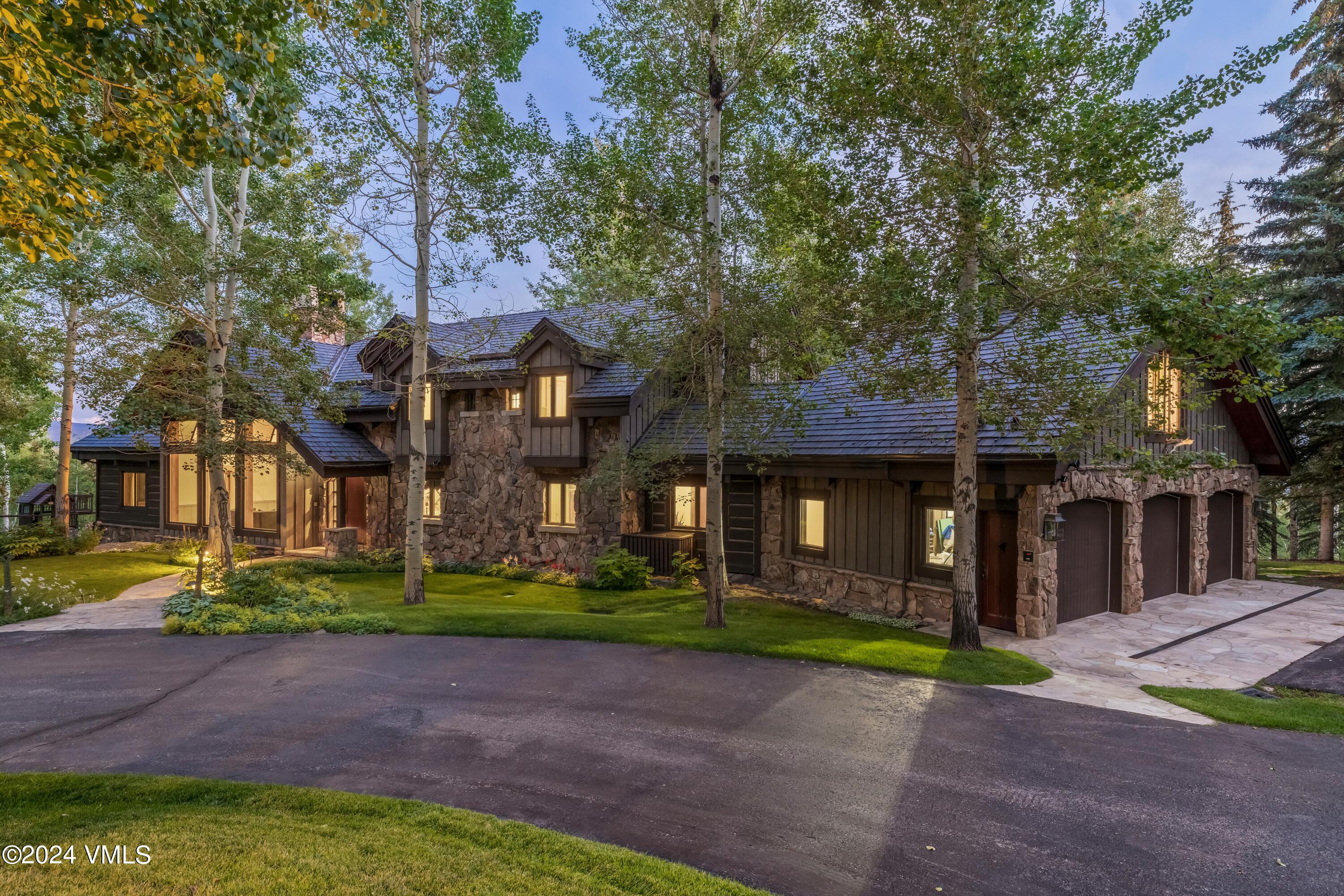 48 Jasmine Avon, CO 81620 - Photo 65 of 67 a front view of a house with a garden