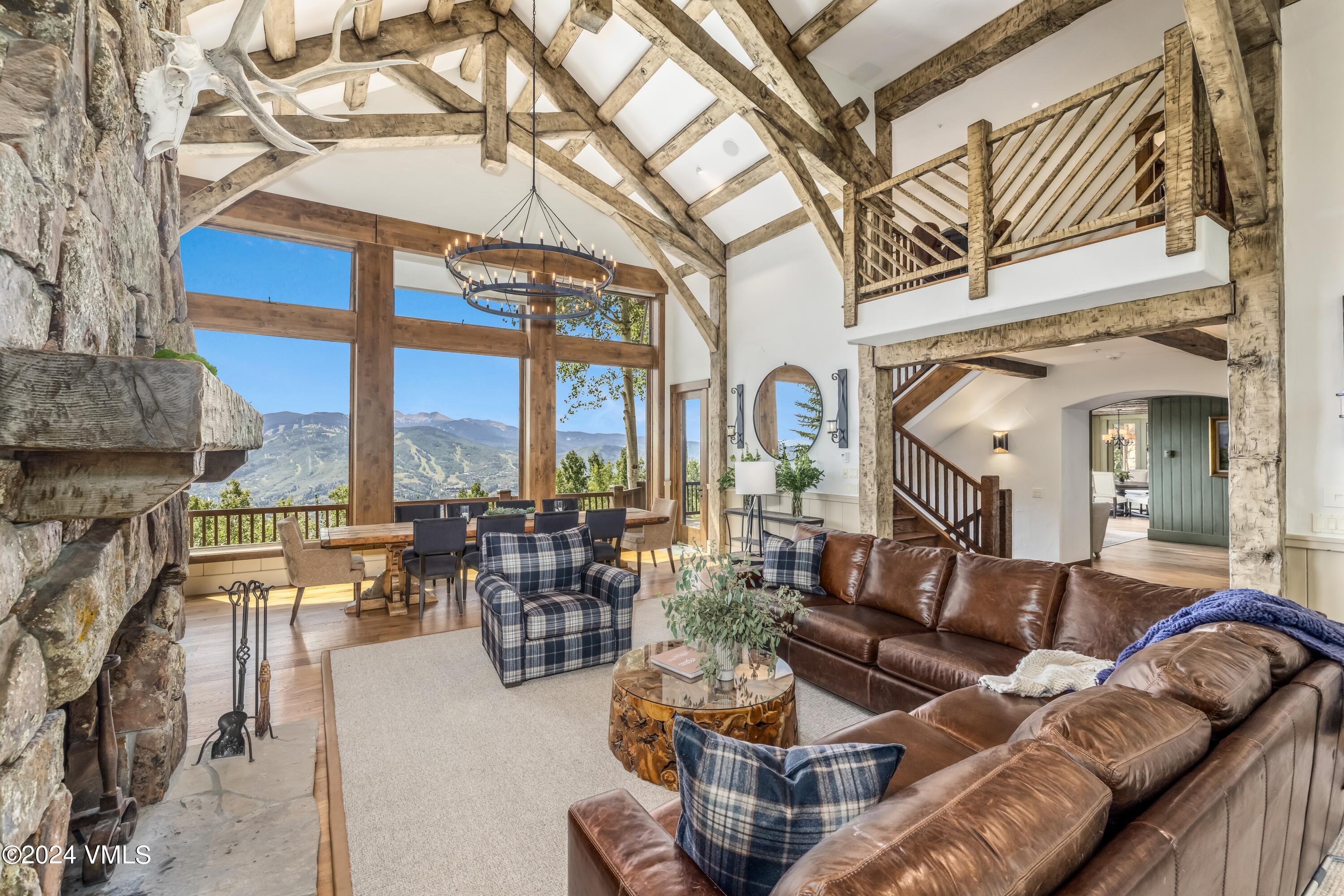 48 Jasmine Avon, CO 81620 - Photo 8 of 67 a living room with furniture a fireplace and large windows